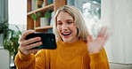 Happy woman, video call and wave with phone for virtual meeting, conversation or discussion on sofa at home. Female person talking on mobile smartphone for online chat or communication in living room
