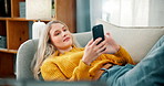 Home, chill and woman with phone on sofa for online chatting, communication and networking. Relax, apartment and person on smartphone for social media, website and internet videos in living room