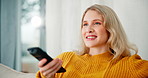 Happy woman, relax and watching tv with remote on sofa for entertainment, movie or show in living room at home. Young female person with smile for online subscription, streaming or series at house