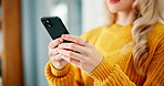 Typing, phone and hands of woman in home for chatting on internet, communication and networking. Relax, weekend and person on smartphone for social media, website and online message in living room