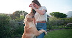 Woman, dog and play with ball in backyard for game exercise, training and learning obedience by running in outdoor together. Female person, animal and pet with love, bonding and friends in nature