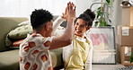 Apartment, high five and couple celebrating on floor in new home, house or living room. Smile, property furniture and man with woman moving in real estate with boxes, rug and excited unpacking