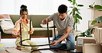 Couple, assemble table and move in to new home for renovations, relocation and furniture building. Relationship, man and woman together with boxes for bonding, support and partnership with love