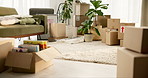 Interior, boxes and moving in with new home, furniture or living room space for relocation, rent or apartment. Empty house with packages, equipment or open lounge for real estate, mortgage or decor