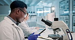 Science, laboratory and black man with microscope and tablet for online research, medical results and vaccine. Healthcare, biotechnology and scientist on digital tech for study, experiment and sample