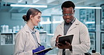 People, scientist and writing with tablet for research, scientific discovery or test results at laboratory. Man and woman taking notes in discussion with technology for biology or browsing at lab