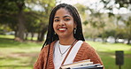 Black woman, student and confidence with books in nature for learning, education or studying at outdoor park. Portrait of young African with smile or textbooks for academic journey, ambition or dream