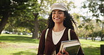 Happy woman, student and confidence with books in nature for learning, education or studying at outdoor park. Portrait of young female person with smile or textbooks for academic journey or ambition