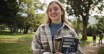 Happy woman, student and confidence with books at park for learning, education or ambition for scholarship. Portrait of female person with smile or textbooks for academic journey or path to future