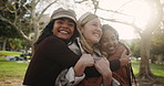 Outdoor hug, women and friends with laughing for love relationship and support for care. Gen z girls, excited embrace and bonding together in nature park with smile for happy reunion and peace