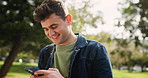 Happy man, student and walking with phone at park for social media or communication. Young male person typing on mobile smartphone with smile for outdoor discussion, online texting or app in nature