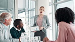 Business woman, tablet and coaching with presentation in meeting for corporate growth, finance or revenue at office. Young female person or employee talking to group for company profit or investment