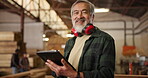 Carpenter, mature man and tablet for woodwork in workshop with digital checklist, timber inventory or online order. Carpentry, happy worker and planning in factory for ecommerce and quality assurance