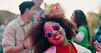 Party, music and happy woman dance with alcohol outdoor for celebration, rave or energy at summer social event with friends. Girl, drink or moving at disco gathering, festival and smile in sunglasses