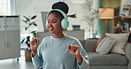 Woman, dance and headphones with tech in office for web design, editing or listening to music. Multimedia, sound and creative designer with energy at desk for online radio, audio or digital streaming