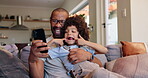 Phone, father and child with funny faces for video call in home, smile and happy in lounge of apartment. House, son and dad with mobile, goofy and playful for communication, living room and couch