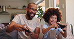 Happy dad, child and playing with video games on sofa for fun bonding, leisure or weekend at home. Excited father with son, little boy or kid on console or controller for co op gameplay at house