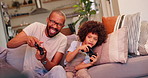 Happy dad, child and video games with controller on sofa for fun bonding, leisure or weekend at home. Excited father with son, little boy or kid playing on console in racing match or esports at house