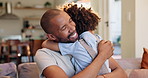 Smile, hugging and dad with child on sofa relaxing in living room for fathers day celebration. Happy, love and boy kid embracing black man on couch in lounge for bonding together at family home.