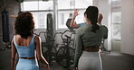 Coach, women and high five with fitness in gym for welcome, greeting or happy for exercise or workout. Personal trainer, friends and hand gesture for team building, motivation and training class