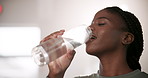 Black woman, drinking water and health in gym with exercise for fitness break, thirsty and hydration for body wellness. Athlete, person and lens flare with liquid from training and physical activity