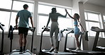 People, runners and high five with treadmill in fitness for gym workout, training or cardio exercise. Group of athletes or friends walking on running machine for weight loss at health club together