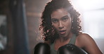 Boxing, face and girl in gym for punch, training and preparation for mma competition. Fitness center, professional and female boxer with gloves for power, energy and workout for sports challenge