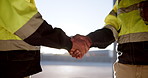 Handshake, architects or construction workers agree for partnership, teamwork and collaboration. People, support or community greeting together on site for inspection, maintenance and logistics