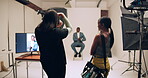 Photographer, camera and model in studio for 
photography, media and magazine cover as creative. Cameraman, focus and female person backstage for shooting, production and film as director with lens