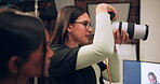 Photographer, camera and light in studio for 
photography, media and magazine cover as creative. Cameraman, focus and female person backstage for shooting, production and film as director with lens