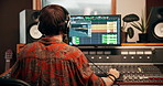 Computer, recording and man with sound board, screen and mixer for music, audio engineering or technology. Song composition, studio or producer with equipment, headphones or techno artist with talent