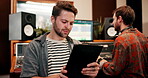 Man, producer and browsing tablet in music studio for online or internet research for lyrics or song. Musician, dj and artist with networking for album ideas, recording and creativity for production