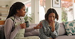 Sad woman, advice and friends on sofa with conversation, support and solution, problem solving and trust at home. Comfort, understanding or women in a living room with bad news, empathy or discussion