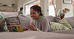 Woman, relax and couch with laptop for work from home, elearning and online course with smile. Writing, email and search on a website for digital copywriting program in a lounge with technology 