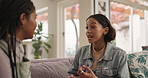 Friends, girl and conflict with fight on sofa in home for disagreement, frustrated and argument with shouting. Gen z, people and stress on couch in living room with anger, discussion and dispute