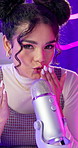 Woman, podcast and blowing kisses in microphone with neon background for audio or sound therapy. Woman, influencer and live streaming for sleeping or mental health and sensation on relaxation or calm