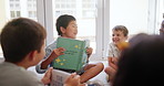 Happy, kids and books in classroom together for educational development, group learning and growth. Students, reading or studying in school for support, knowledge and storytelling or bonding