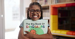 Girl, child and portrait with book in school, happiness for storytelling or literacy education. Female student, youth classroom and kid with smile for knowledge or learning, glasses with hug