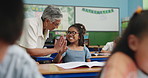 Development, education or high five with teacher and student in classroom for success or support. Homework, motivation and well done with woman talking to girl child in class for school study