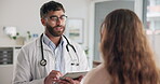 Male doctor and tech with woman, patient and advice for wellness or consultation in hospital or clinic. Healthcare professional, tablet and people in office for diagnosis, results or support