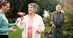 Park, physical therapy and dumbbell with senior couple, exercise and caregiver outdoor. Personal trainer, help and fitness for health and wellness in nursing home garden with support and arm training