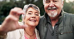 Senior couple, heart hands and selfie at park for care, love or smile for bonding in retirement in morning. Elderly man, woman and embrace in portrait for connection, happy and outdoor in New Orleans