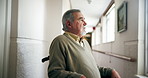 Elderly man, wheelchair and thinking by window in nursing home, reflection or planning for health. Thoughtful, memory and person with disability in wellness center, nostalgia for youth in hallway