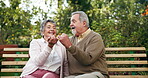 Promise, senior or couple in park for love, trust or connection on bench in outdoor nature. Support, pinky or elderly people relax on date in marriage, agreement or commitment for kindness or respect