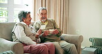 Senior couple, people and happy with photo album in home at living room for memories, nostalgia and retirement. Relationship, love and bonding in lounge as pensioner with support, care and trust