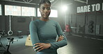 Arms crossed, fitness and serious with woman in gym for start of challenge, training or workout routine. Exercise, confident and portrait of African person in health club for physical improvement