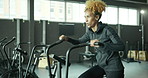 Fitness, gym and woman on bicycle machine for health, wellness and weightloss workout training. Endurance, active and female athlete on electric bike equipment for cardio exercise in sports center.