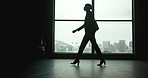 Office, walking and silhouette of woman in window, thinking and business in law firm. Female lawyer, ready and lobby in building for scheduled meeting, professional and employee in workplace