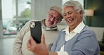 Senior couple, video call and laugh with phone in home for talk, communication or love. Man, woman and virtual chat on smartphone for funny conversation, retirement or smile in living room together