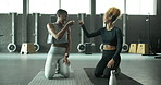 Success, teamwork and woman in gym fitness, pilates or training with fist bump for achievement or support. Sports friends with motivation, power and ready or talking of workout and exercise goals